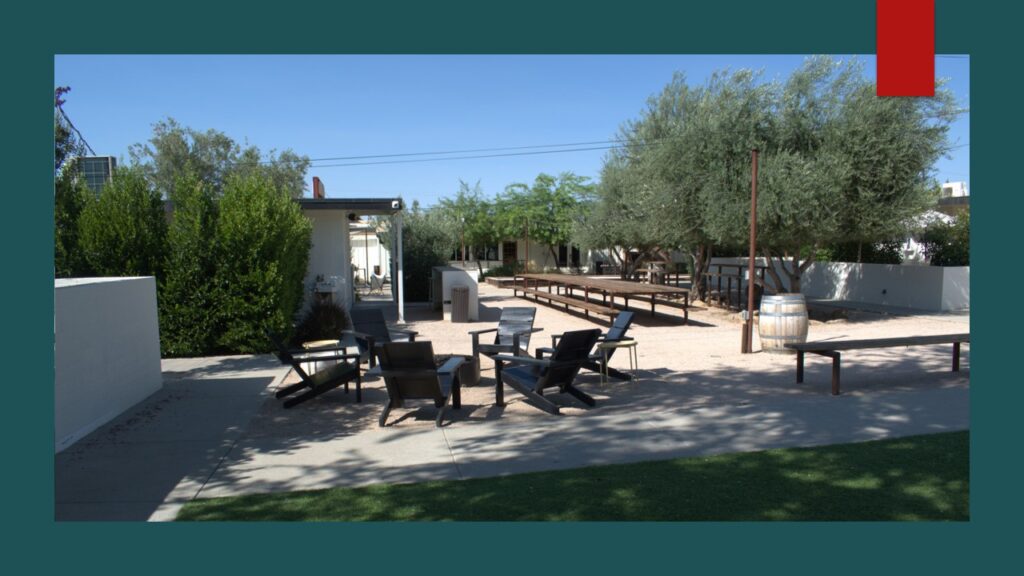 Aerial view of a vast desert landscape under a blue sky.