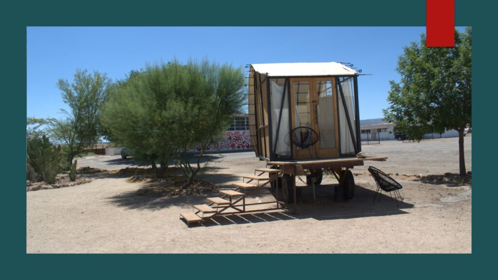Aerial view of a dry, mountainous landscape with sparse vegetation.