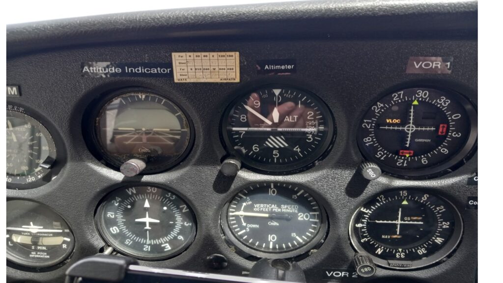 Close-up of aircraft cockpit instruments and gauges.