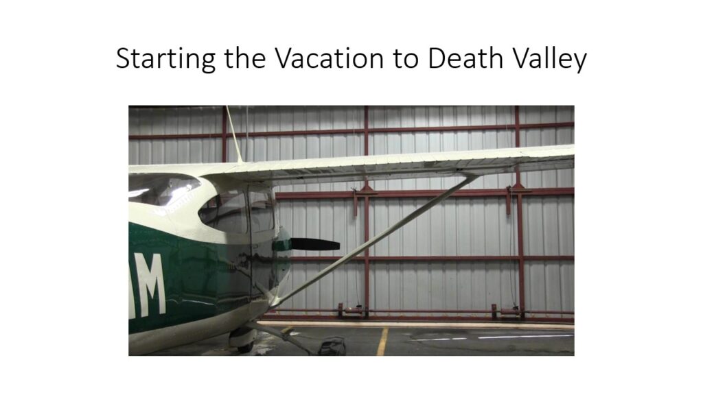 Small airplane parked inside a hangar.