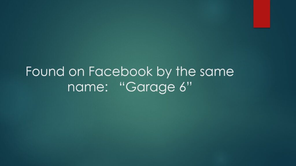 Small airplane parked inside a hangar.