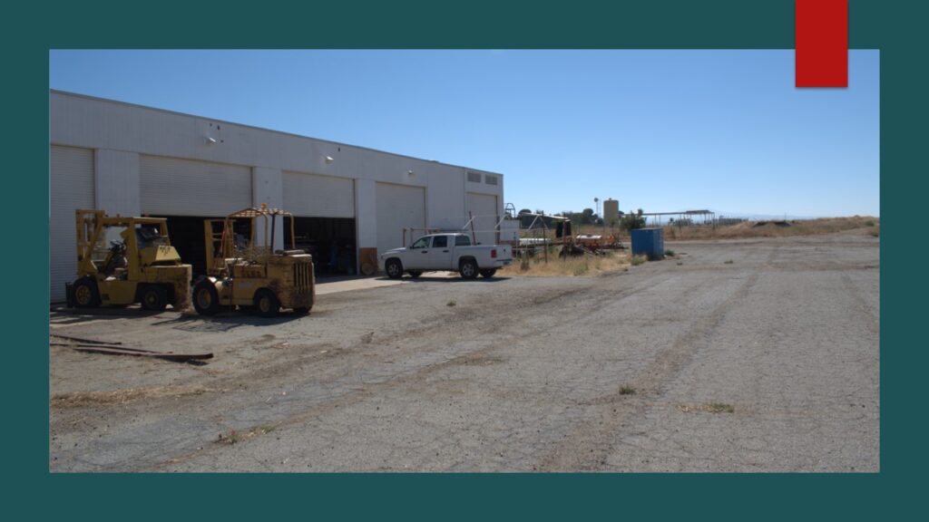 Small airplane parked inside a hangar.