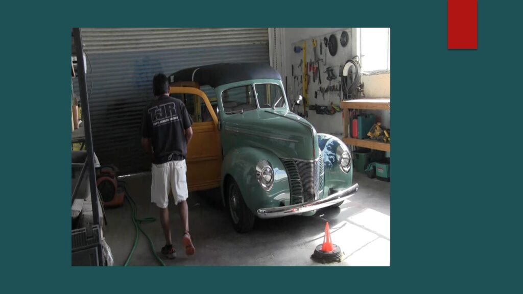 Small airplane parked inside a hangar.