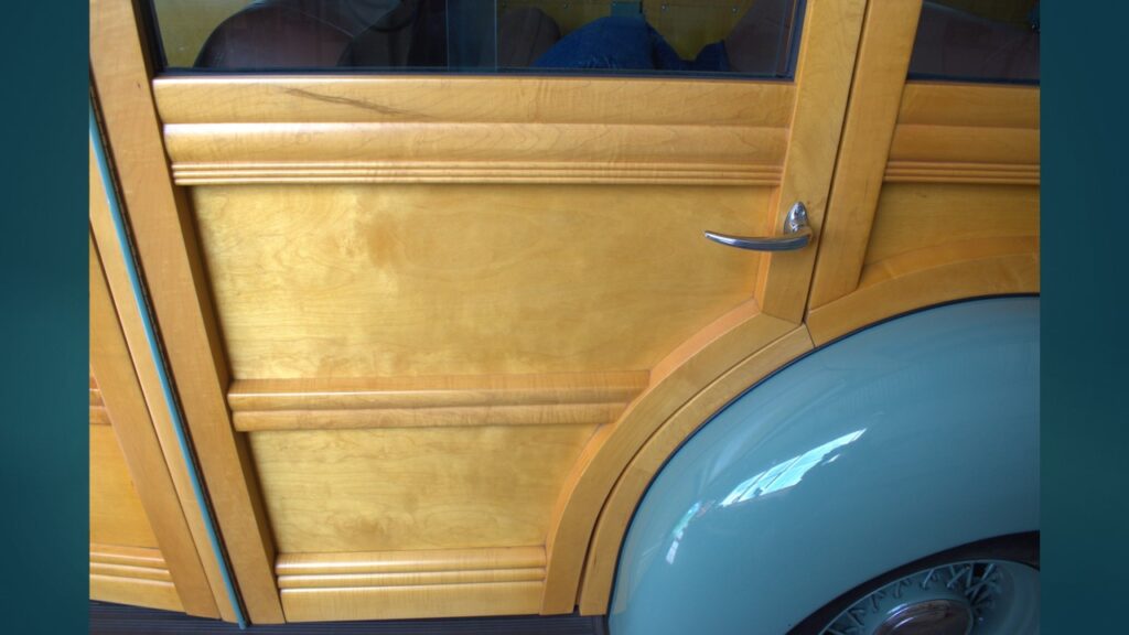 Small airplane parked inside a hangar.