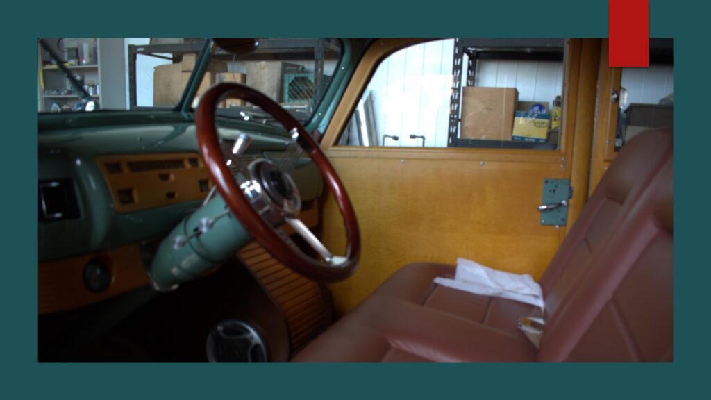 Small airplane parked inside a hangar.